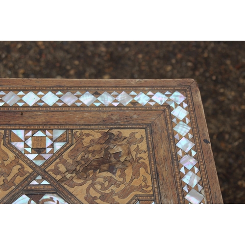 24 - MOORISH INLAID MAHOGANY OCCASIONAL TABLE WITH MOTHER OF PEARL AND MARQUETRY ARABIC SCRIPT 
45 X 64CM