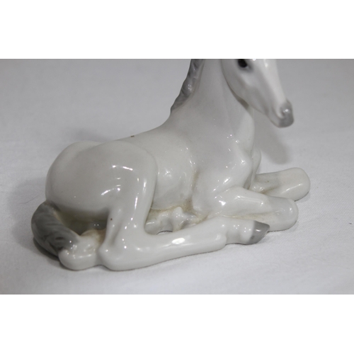 851 - USSR FIGURE OF A YOUNG HORSE SITTING 
14 X 11CM