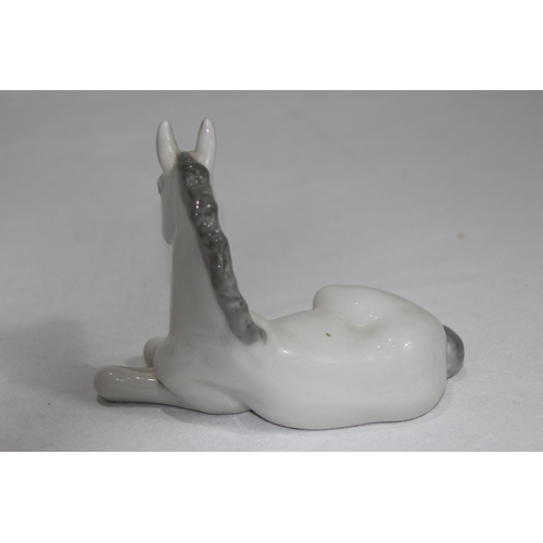 851 - USSR FIGURE OF A YOUNG HORSE SITTING 
14 X 11CM