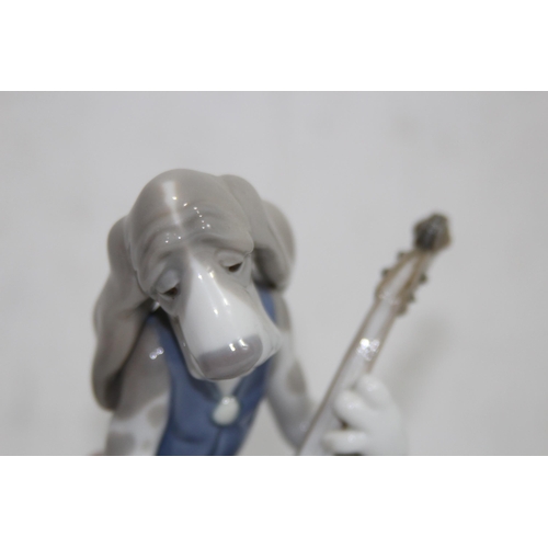 853 - LLADRO FIGURE OF A DOG PLAYING A CELLO - A/F TO STEM
22CM