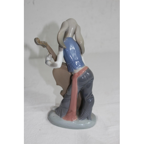 853 - LLADRO FIGURE OF A DOG PLAYING A CELLO - A/F TO STEM
22CM