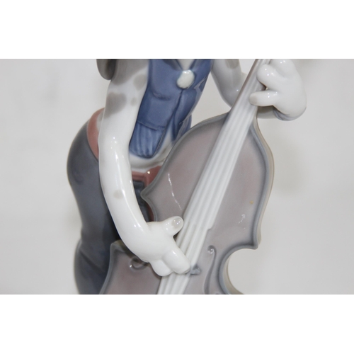 853 - LLADRO FIGURE OF A DOG PLAYING A CELLO - A/F TO STEM
22CM