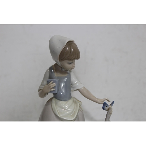 854 - NAO FIGURE OF A YOUNG GIRL WITH BUTTERFLY
22CM