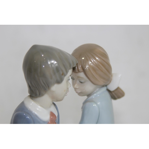 855 - NAO FIGURE OF A YOUNG COUPLE SITTING ON A BENCH
16.5 X 13CM