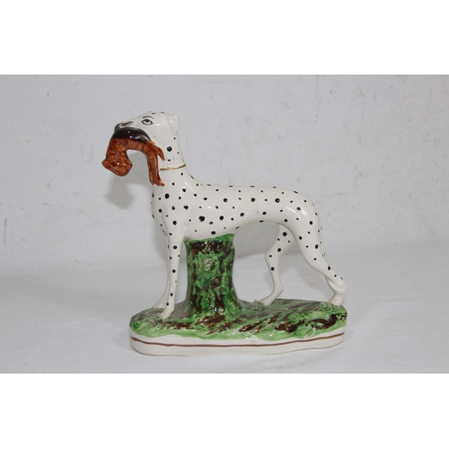 864 - STAFFORDSHIRE DOG WITH HARE 
19 X 18CM