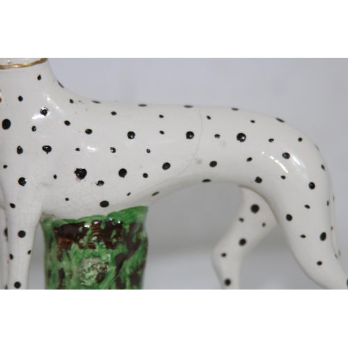 864 - STAFFORDSHIRE DOG WITH HARE 
19 X 18CM