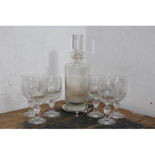 875 - SET OF SIX ETCHED WINE GLASSES AND DECANTER - 1 HAS CHIP TO RIM AND DECANTER IS CHIPPED TO RIM