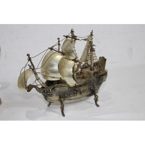 429 - METAL GALLEON AND BRASS MAGNIFYING GLASS
23 X 20CM