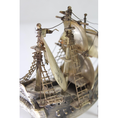 429 - METAL GALLEON AND BRASS MAGNIFYING GLASS
23 X 20CM