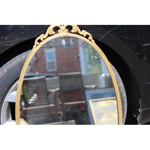 154 - ORNATE BRASS MIRROR
76 X 44CM