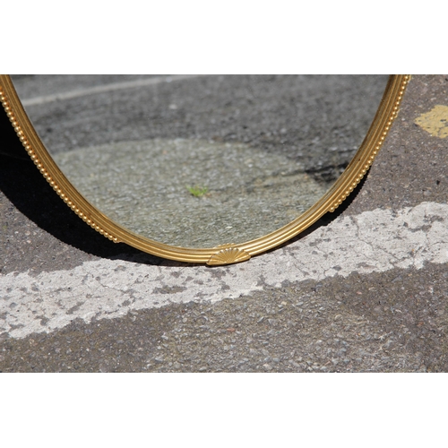 154 - ORNATE BRASS MIRROR
76 X 44CM