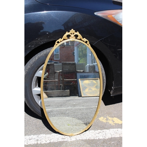 154 - ORNATE BRASS MIRROR
76 X 44CM