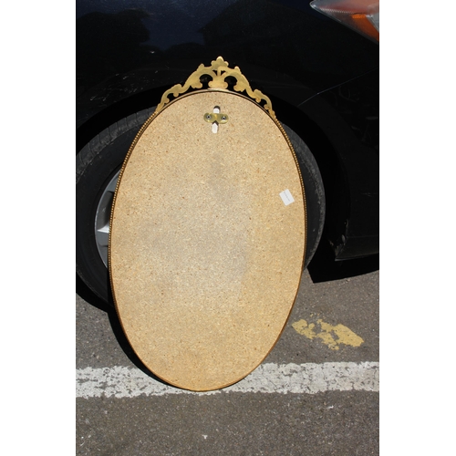 154 - ORNATE BRASS MIRROR
76 X 44CM