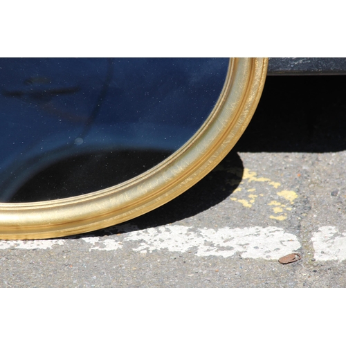 165 - PAIR OF GOLD FRAMED OVAL MIRRORS 
80 X 61CM