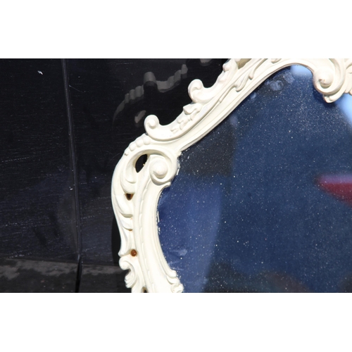 214 - PAINTED ORNATE FRAMED MIRROR 
82 X 57CM