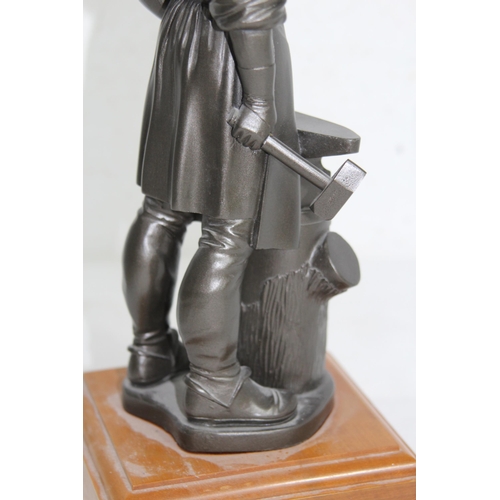 914 - REGIMENTAL STATUE OF A BLACKSMITH
34CM