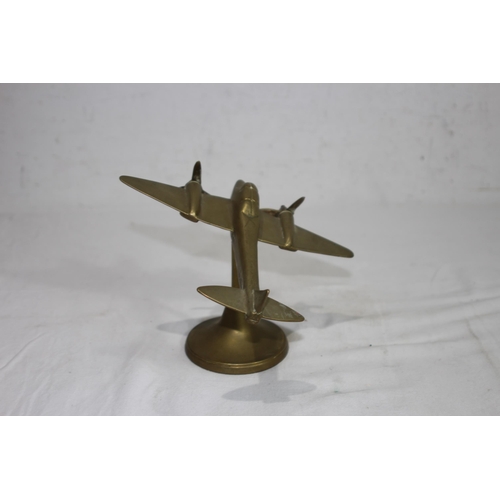 919 - BRASS METAL OF A VINTAGE AIRCRAFT ON STAND 
16 X 14CM