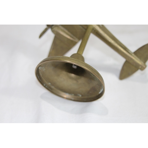 919 - BRASS METAL OF A VINTAGE AIRCRAFT ON STAND 
16 X 14CM