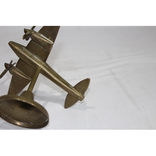 919 - BRASS METAL OF A VINTAGE AIRCRAFT ON STAND 
16 X 14CM