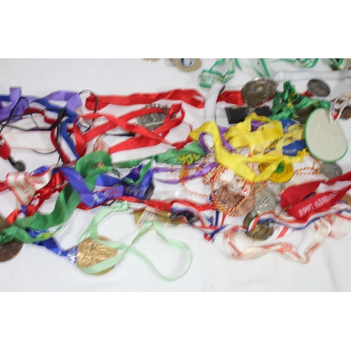 497 - LARGE QUANTITY OF SPORTING MEDALS ETC