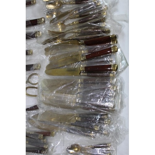 526 - LARGE SET OF BRONZED COLOUR CUTLERY - NEW AND COMPLETE