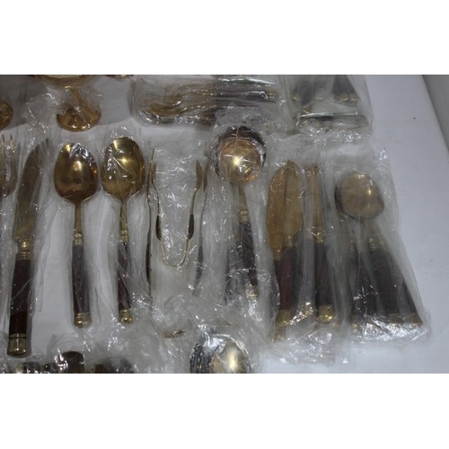 526 - LARGE SET OF BRONZED COLOUR CUTLERY - NEW AND COMPLETE