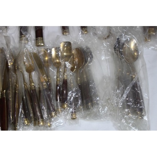 526 - LARGE SET OF BRONZED COLOUR CUTLERY - NEW AND COMPLETE