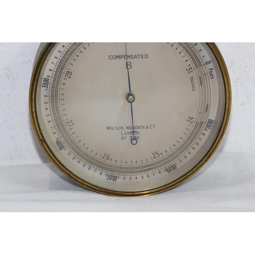 930 - VINTAGE WILSON WARDEN AND CO LONDON NO 3214 BRASS BAROMETER 
12CM