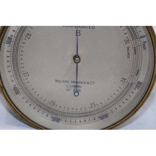 930 - VINTAGE WILSON WARDEN AND CO LONDON NO 3214 BRASS BAROMETER 
12CM