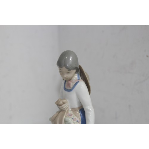 876 - LLADRO FIGURINE OF A YOUNG GIRL WITH CANDLE AND ONE OTHER 
21CM