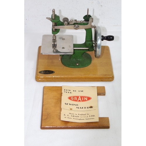 687 - VINTAGE CHILDS GRAIN SEWING MACHINE IN BOX