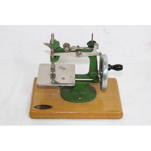 687 - VINTAGE CHILDS GRAIN SEWING MACHINE IN BOX