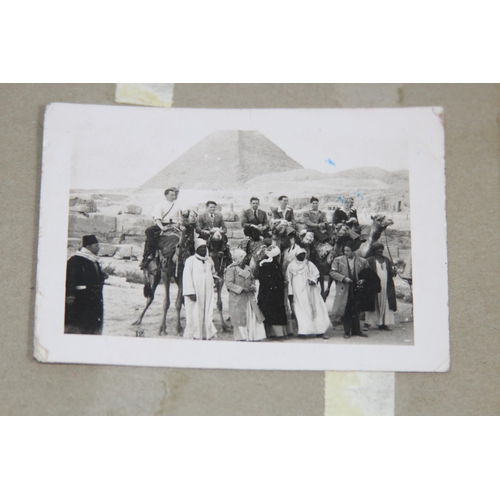 945 - MILITARY LINKED SCRAP BOOK CONTAINING A QUANTITY OF PHOTOS OF ROYAL NAVY SAILOR ON HIS TRAVELS IN TH... 