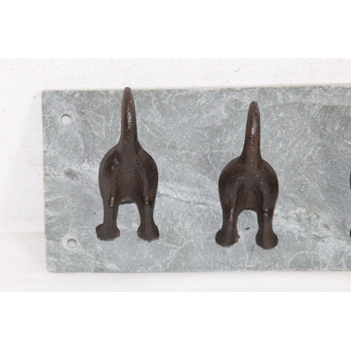 593 - NOVELTY DOGS BOTTOMS AND TAILS FORM CLOTHES HANGER ON A SLATE BACK
30 X 10CM