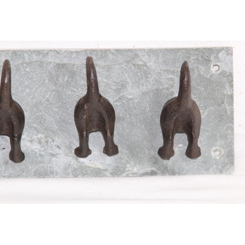 593 - NOVELTY DOGS BOTTOMS AND TAILS FORM CLOTHES HANGER ON A SLATE BACK
30 X 10CM