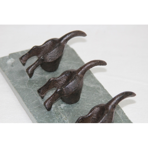 593 - NOVELTY DOGS BOTTOMS AND TAILS FORM CLOTHES HANGER ON A SLATE BACK
30 X 10CM