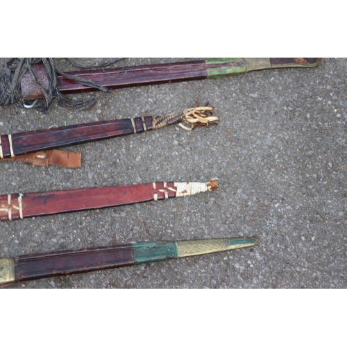 608 - FIVE ANTIQUE AND VINTAGE SWORDS, BELIEVED TO BE OF AFRICAN DESENT