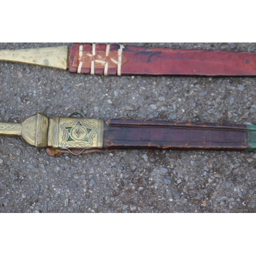 608 - FIVE ANTIQUE AND VINTAGE SWORDS, BELIEVED TO BE OF AFRICAN DESENT