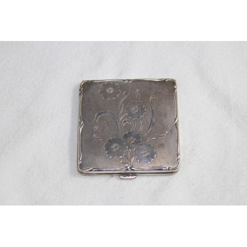 1099 - SILVER COMPACT OF OCTAGONAL FORM - BIRMINGHAM 1951 AND A FLORAL DECORATED WHITE METAL COMPACT