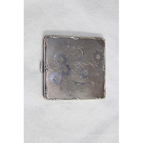 1099 - SILVER COMPACT OF OCTAGONAL FORM - BIRMINGHAM 1951 AND A FLORAL DECORATED WHITE METAL COMPACT