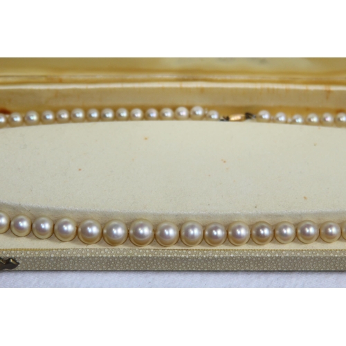 1182 - 2 X 9CT GOLD CLASPED GRADUATED FAUX PEARL NECKLACES, ONE CASED AND RETAILED BY CIRO OF BOND STREET