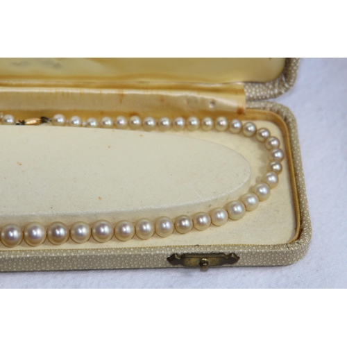 1182 - 2 X 9CT GOLD CLASPED GRADUATED FAUX PEARL NECKLACES, ONE CASED AND RETAILED BY CIRO OF BOND STREET