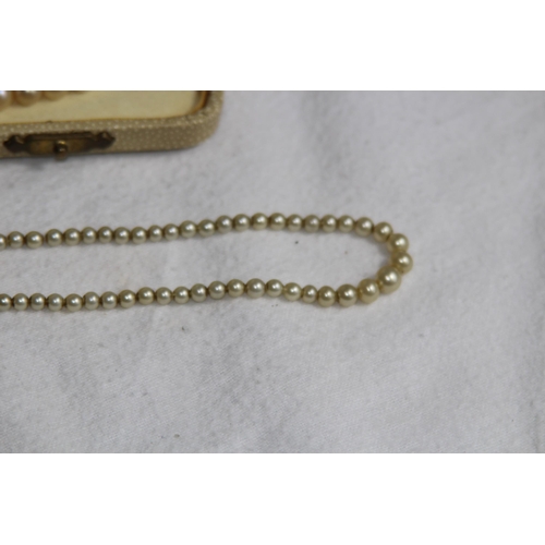 1182 - 2 X 9CT GOLD CLASPED GRADUATED FAUX PEARL NECKLACES, ONE CASED AND RETAILED BY CIRO OF BOND STREET