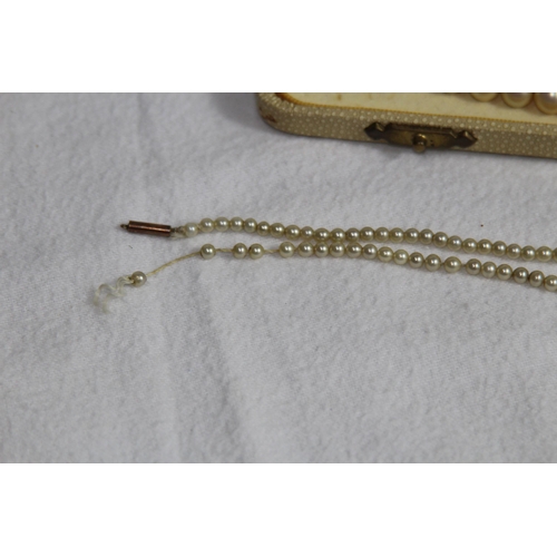 1182 - 2 X 9CT GOLD CLASPED GRADUATED FAUX PEARL NECKLACES, ONE CASED AND RETAILED BY CIRO OF BOND STREET