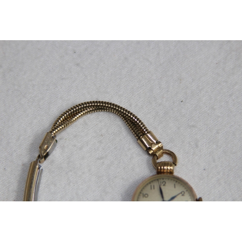 1190 - 9CT GOLD CASED WATCH ON A ROLLED GOLD BRACELET - TOTAL WEIGHT 18G