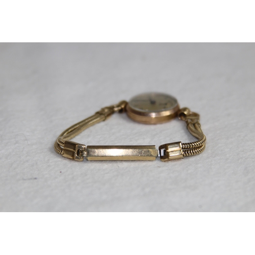 1190 - 9CT GOLD CASED WATCH ON A ROLLED GOLD BRACELET - TOTAL WEIGHT 18G