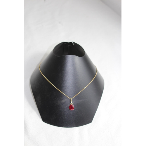 1220 - LARGE RUBY AND DIAMOND 9CT GOLD NECKLANE - 5.25G - BOXED