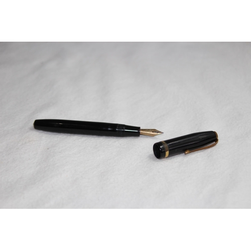 1224 - 14CT GOLD NIB CONWAY FOUNTAIN PEN AND A YELLOW METAL TWIST ACTION PENCIL MARKED R.M AND CO