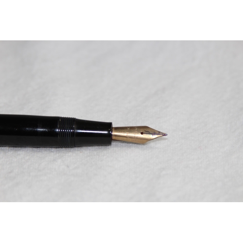 1224 - 14CT GOLD NIB CONWAY FOUNTAIN PEN AND A YELLOW METAL TWIST ACTION PENCIL MARKED R.M AND CO