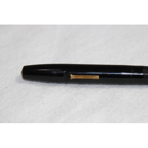 1224 - 14CT GOLD NIB CONWAY FOUNTAIN PEN AND A YELLOW METAL TWIST ACTION PENCIL MARKED R.M AND CO